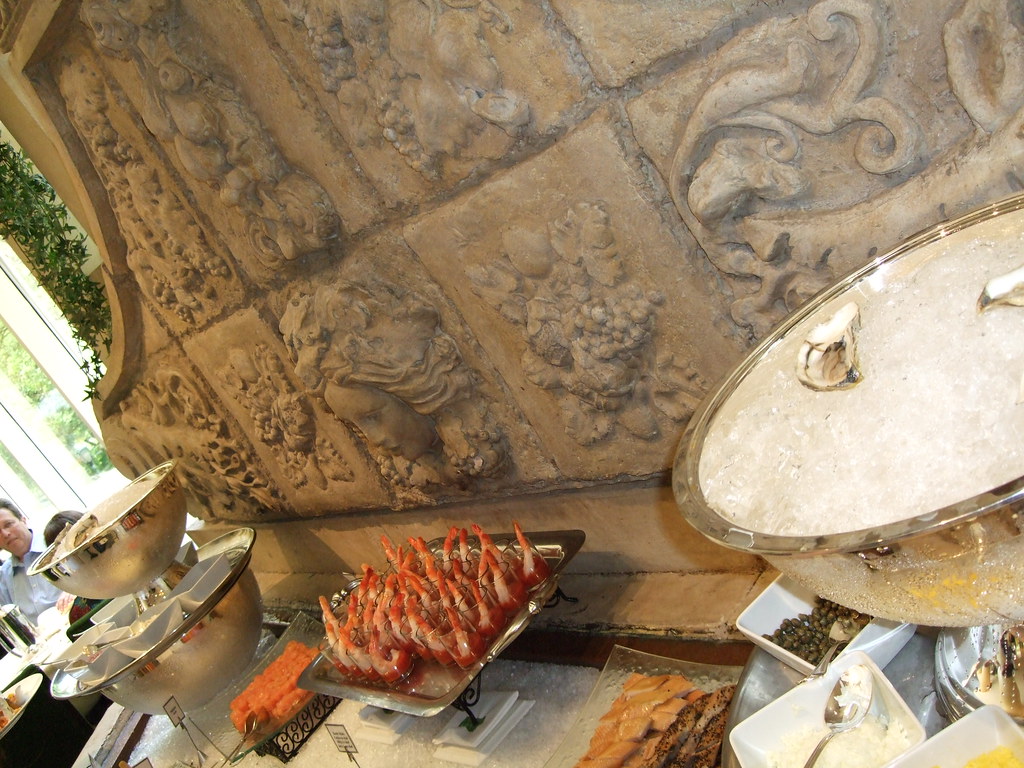 A lavish Aegean seafood spread with mezeler, grilled fish, and fresh lemons